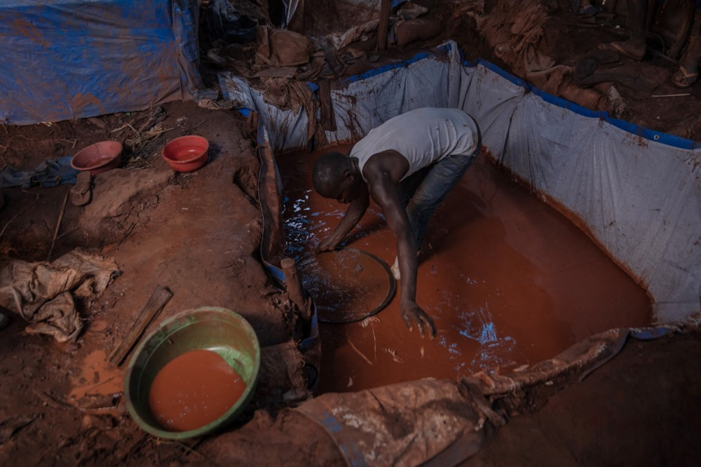 An artisanal miner pans for gold in the Luhihi gold mine, 50km from the town of Bukavu, capital of South Kivu province in eastern Democratic Republic of Congo, on November 6, 2021. u00e2u20acu201d AFP pic
