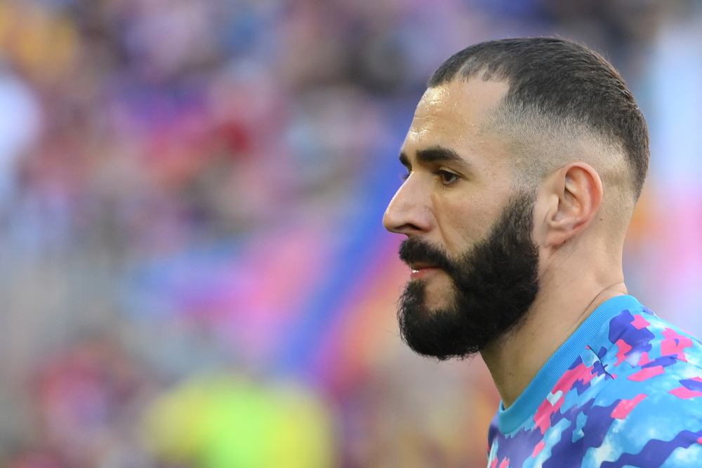 Real Madridu00e2u20acu2122s French forward Karim Benzema looks on as he warms up prior to the Spanish League football match between FC Barcelona and Real Madrid CF at the Camp Nou stadium in Barcelona, October 24, 2021. u00e2u20acu201d AFP pic