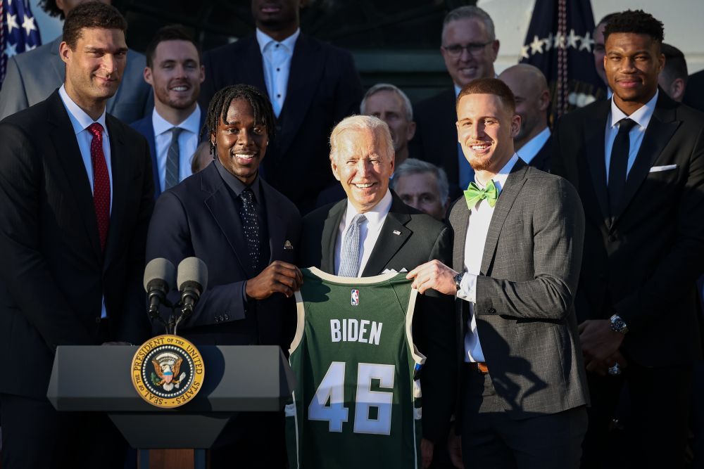 US President Joe Biden stands with Milwaukee Bucks players Jrue Holiday (left) and Donte DiVincenzo (right) during a ceremony to honour the team for its NBA Championship on the South Lawn of the White House November 8, 2021. u00e2u20acu2022 Reuters pic