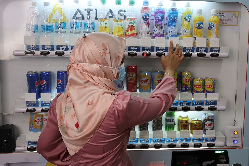 Braille-enabled drink vending machines have been placed in LRT stations across Klang Valley for the visually-impaired community. u00e2u20acu2022 Picture courtesy of Atlas Vending