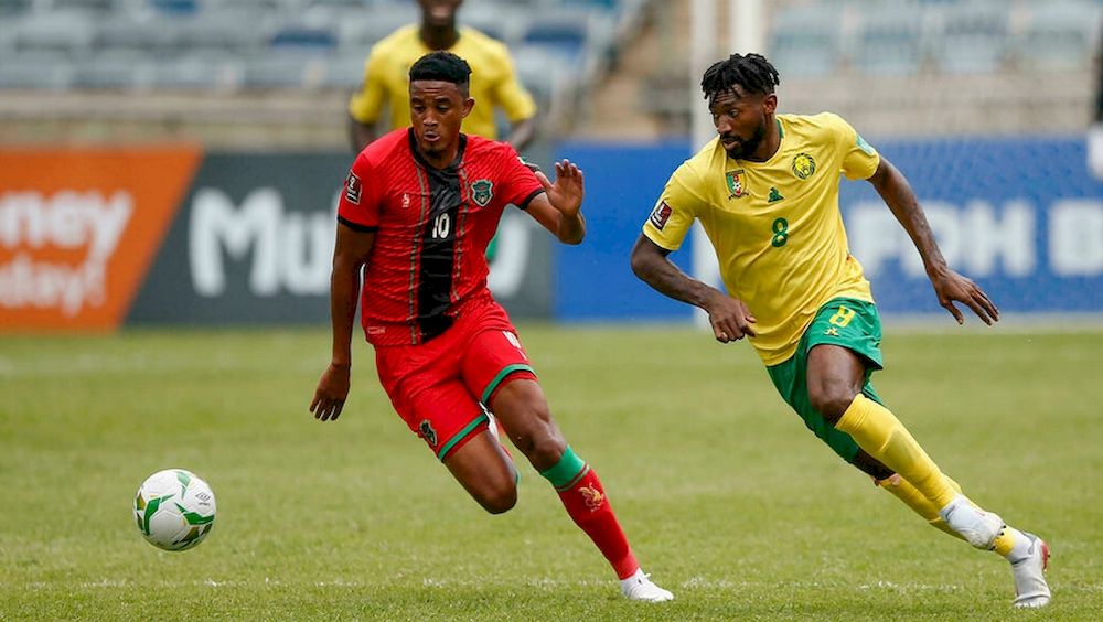 Andre-Frank Zambo Anguissa (right) of Cameroon and Gerald Phiri (left) of Malawi seek possession during a 2022 World Cup qualifier in Soweto on Saturday. u00e2u20acu201d AFP pic