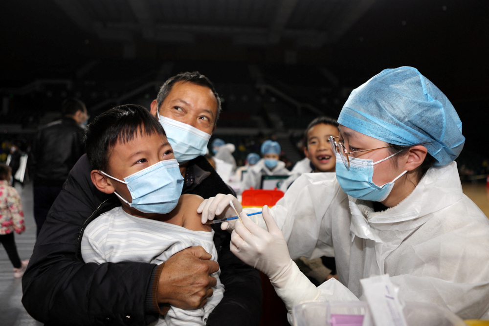 Children being vaccinated against the Covid-19 coronavirus at a basketball gymnasium in Yongchuan in Chongqing in south-west China, November 9, 2021. u00e2u20acu201d AFP picn
