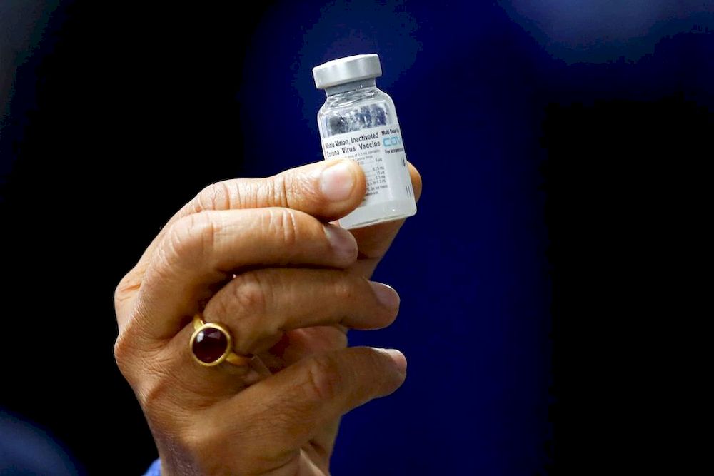 Indian Health Minister Harsh Vardhan holds a dose of Bharat Biotechu00e2u20acu2122s Covid-19 vaccine called Covaxin, during a vaccination campaign at All India Institute of Medical Sciences (AIIMS) hospital in New Delhi, India, January 16, 2021. u00e2u20acu201d Reuters/Adnan Abi
