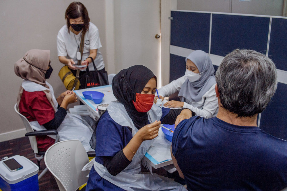 People receive their Covid-19 booster jabs at the UEM Learning Centre in Petaling Jaya, November 24, 2021. u00e2u20acu201d Picture by Shafwan Zaidon     