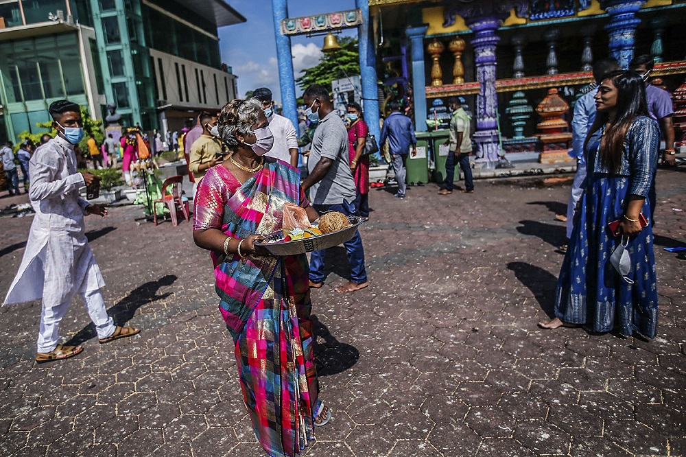 Clad in traditional colourful attire, and yet they still adopted new norms to curb the spread of the Covid-19 pandemic by adhering to the standard operating procedures (SOPs) set. ― Picture by Hari Anggara