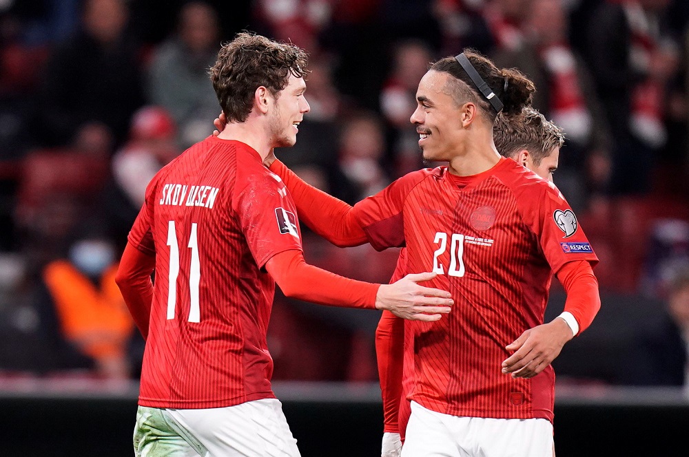 Denmark's Andreas Skov Olsen celebrates with Yussuf Poulsen Liselotte after scoring the first goal against Faroe Islands November 13, 2021. u00e2u20acu2022 Sabroe/Ritzau Scanpix via Reuters