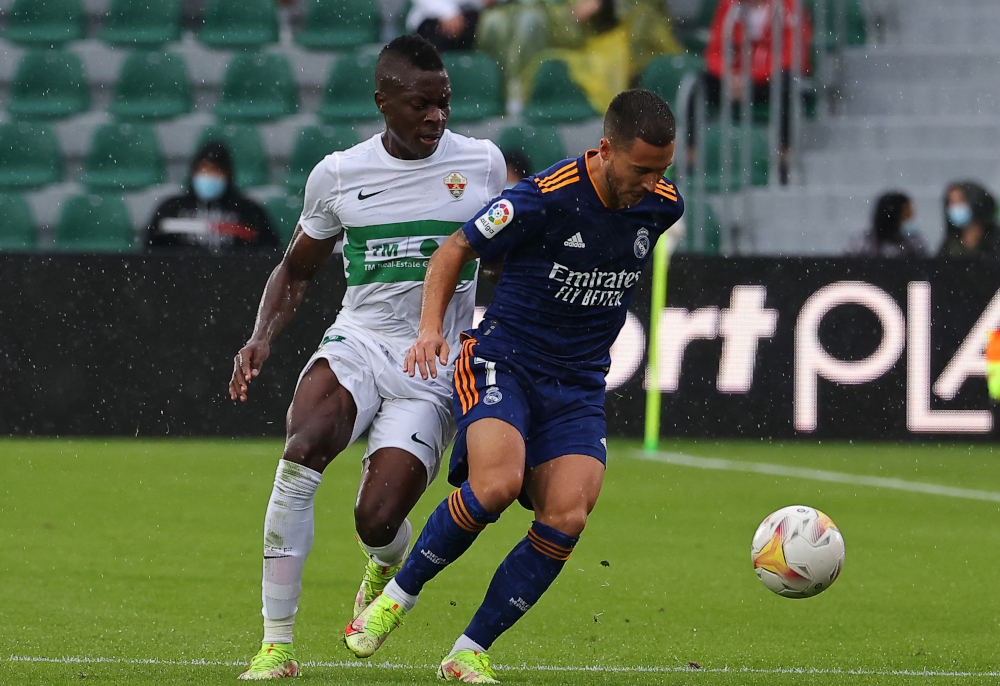 Elche defender Helibelton Palacios fights for the ball with Real Madrid forward Eden Hazard during the Spanish League match at the Martinez Valero stadium in Elche, October 30, 2021. u00e2u20acu201d AFP pic 