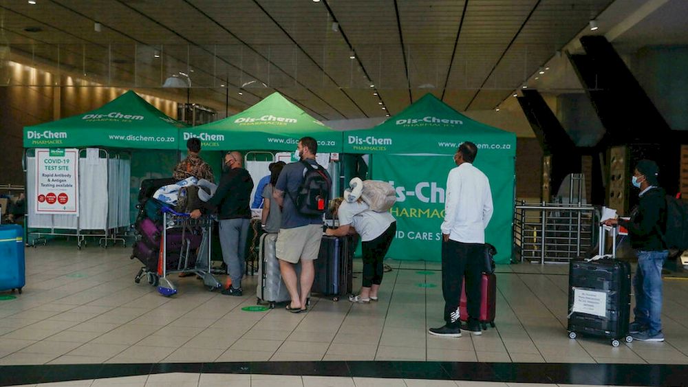 Travellers queue for Covid tests at Johannesburg airport on November 27, 2021, after several countries banned flights from South Africa following the discovery of a new Covid-19 variant. u00e2u20acu201d AFP pic