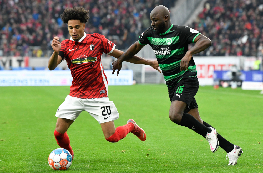 Freiburg forward Kevin Schade and Greuther Fuerth defender Jetro Willems vie for the ball during the German first division Bundesliga football match in Freiburg, southern Germany, October 30, 2021. u00e2u20acu201d AFP pic 