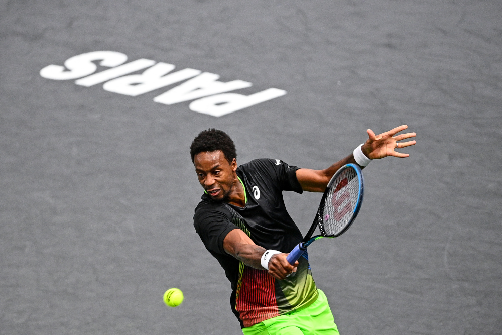 Franceu00e2u20acu2122s Gael Monfils returns the ball to Franceu00e2u20acu2122s Adrian Mannarino during their menu00e2u20acu2122s singles tennis match on day three of the ATP Paris Masters at The AccorHotels Arena in Paris, November 3, 2021. u00e2u20acu201d AFP picnn