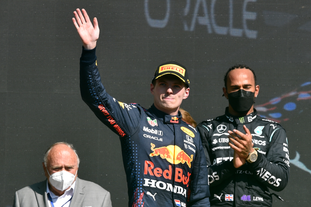 Red Bull driver Max Verstapen celebrates on the podium after winning the Formula One Mexico Grand Prix next to runner-up Mercedes driver Lewis Hamilton at the Hermanos Rodriguez racetrack in Mexico City on City, November 7, 2021. u00e2u20acu201d AFP pic 