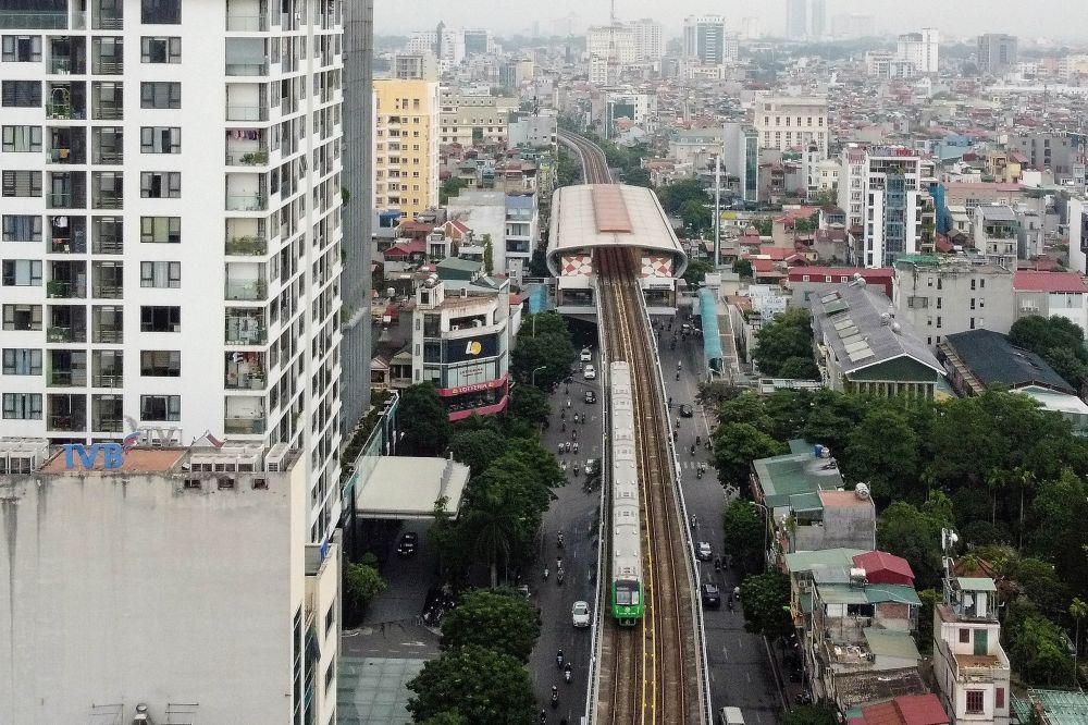 This aerial photograph shows the city's first urban metro train running along the Cat Linh-Ha Dong line on the first day of operation in Hanoi. u00e2u20acu201d ETX Studio pic