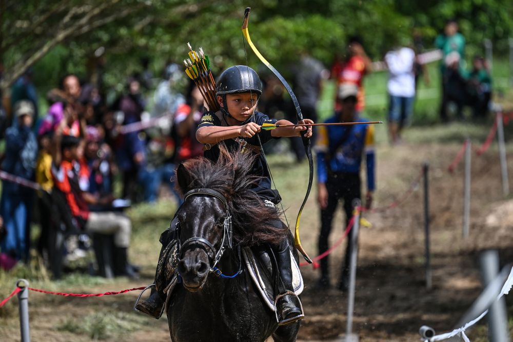 A participant takes part in a Horseback Archery League competition at the Cape Cavallho Equestrian Club in Rembau, Negri Sembilan November 13, 2021. u00e2u20acu201d AFP picn