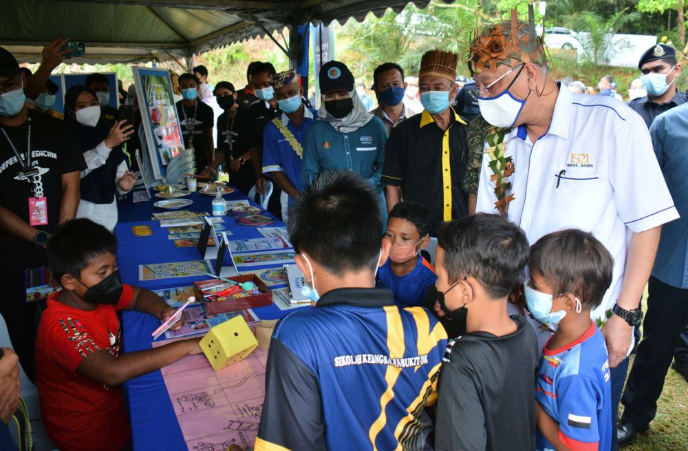Prime Minister Datuk Seri Ismail Sabri Yaakob interacts with Orang Asli children during a visit to Sekolah Kebangsaan Bukit Rok in Bera November 20, 2021. u00e2u20acu201d Bernama picnn