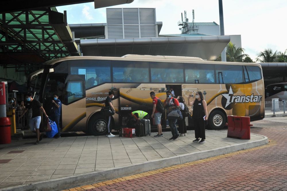 A bus ferrying the first 46 passengers from Singapore arrives at the Larkin Sentral Bus Terminal in Johor Baru November 29, 2021. u00e2u20acu201d Picture by Ben Tan