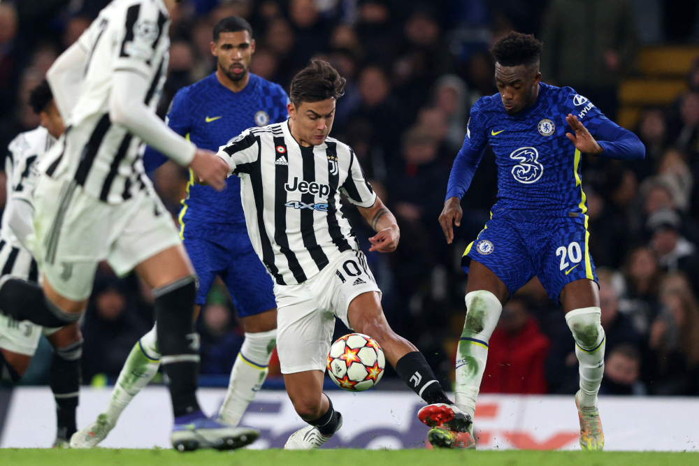 Juventusu00e2u20acu2122 Argentine striker Paulo Dybala vies with Chelseau00e2u20acu2122s English midfielder Callum Hudson-Odoi during the Uefa Champions League Group H football match at Stamford Bridge in London, November 23, 2021. u00e2u20acu201d AFP picnn