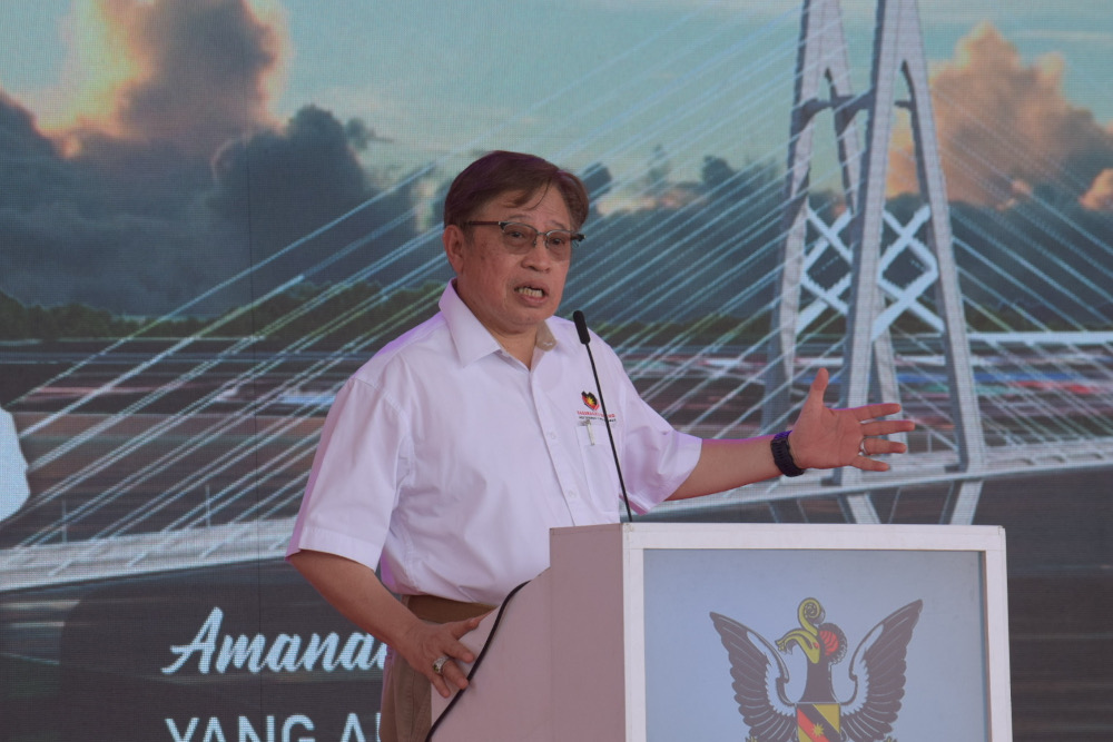 Datuk Patinggi Tan Sri Abang Johari Openg speaks at the earth-breaking ceremony for a bridge to be constructed across Sarawak River at Sejingkat. u00e2u20acu201d Roystein Emmor/Borneo Post pic