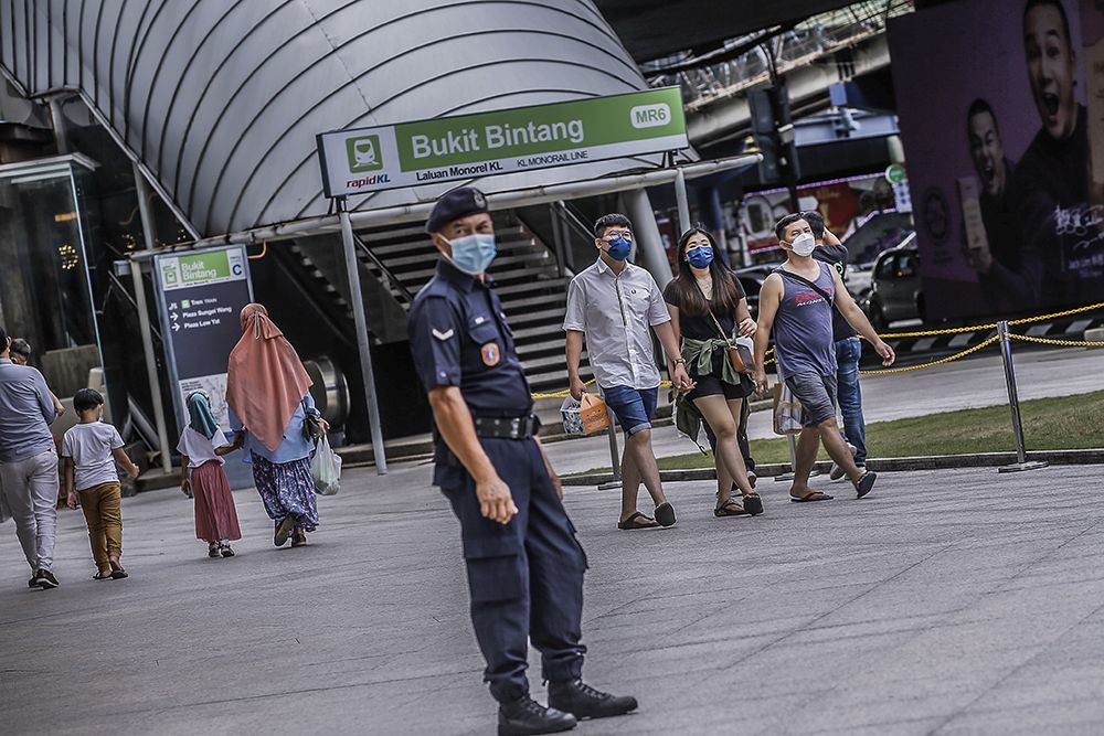 People are seen wearing protective masks as they walk along Jalan Bukit Bintang, Kuala Lumpur November 28, 2021. u00e2u20acu201d Picture by Hari Anggara