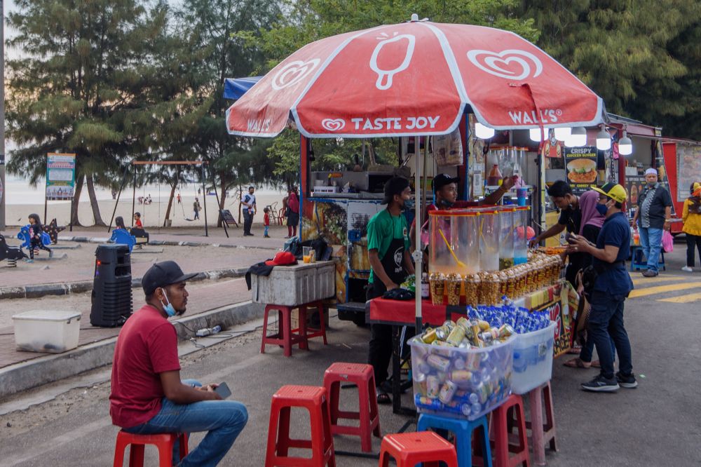 Street vendors are pictured at Pantai Klebang in Melaka  November 16, 2021. u00e2u20acu201d Picture by Shafwan Zaidon