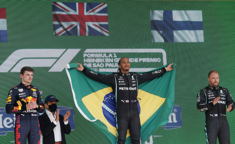 Mercedes' Lewis Hamilton celebrates on the podium after winning the Brazilian Grand Prix at the Jose Carlos Pace Circuit, Sao Paulo November 14, 2021. u00e2u20acu201d Reuters picn