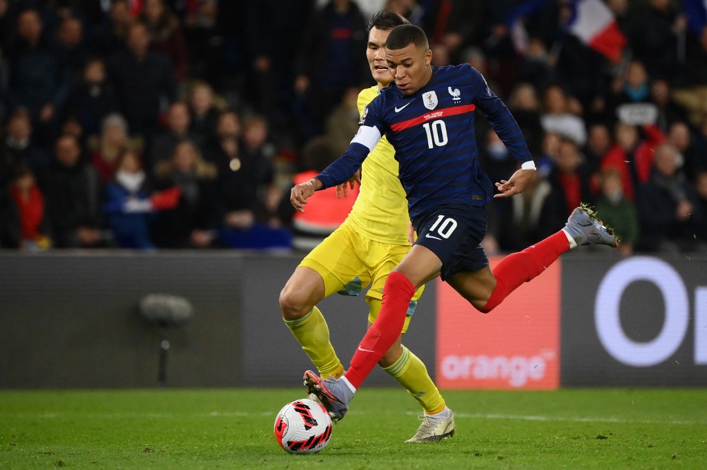 Franceu00e2u20acu2122s forward Kylian Mbappe (right) runs on his way to score his fourth goal during the Fifa World Cup 2022 qualification match between France and Kazakhstan at the Parc des Princes stadium in Paris, on November 13, 2021. u00e2u20acu201d AFP pic
