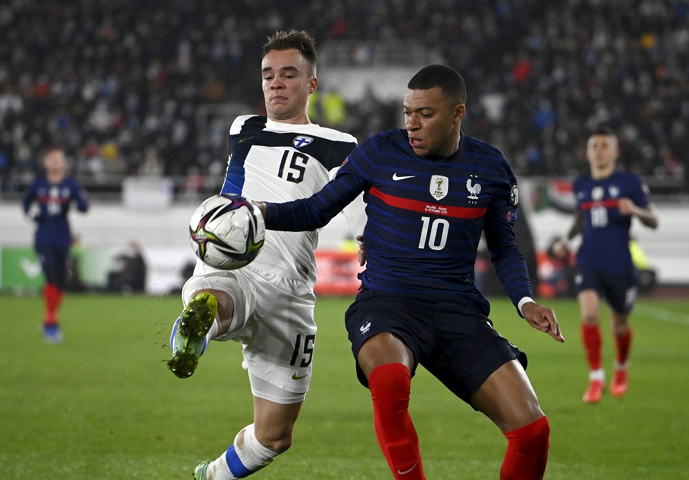 Finland's Leo Vaisanen in action with France's Kylian Mbappe in Helsinki November 16, 2021. u00e2u20acu2022 Lehtikuva via Reuters