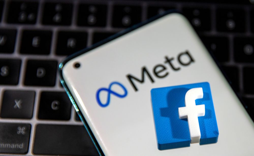 A smartphone with Meta logo and a 3D printed Facebook logo is placed on a laptop keyboard in this illustration taken October 28, 2021. u00e2u20acu201d Reuters pic