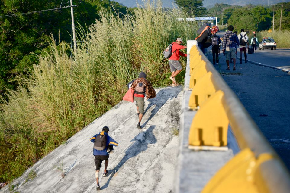 Migrants walk up an overpass in a caravan heading to the northern border, in Tapanatepec, Mexico November 9, 2021. u00e2u20acu201d Reuters pic