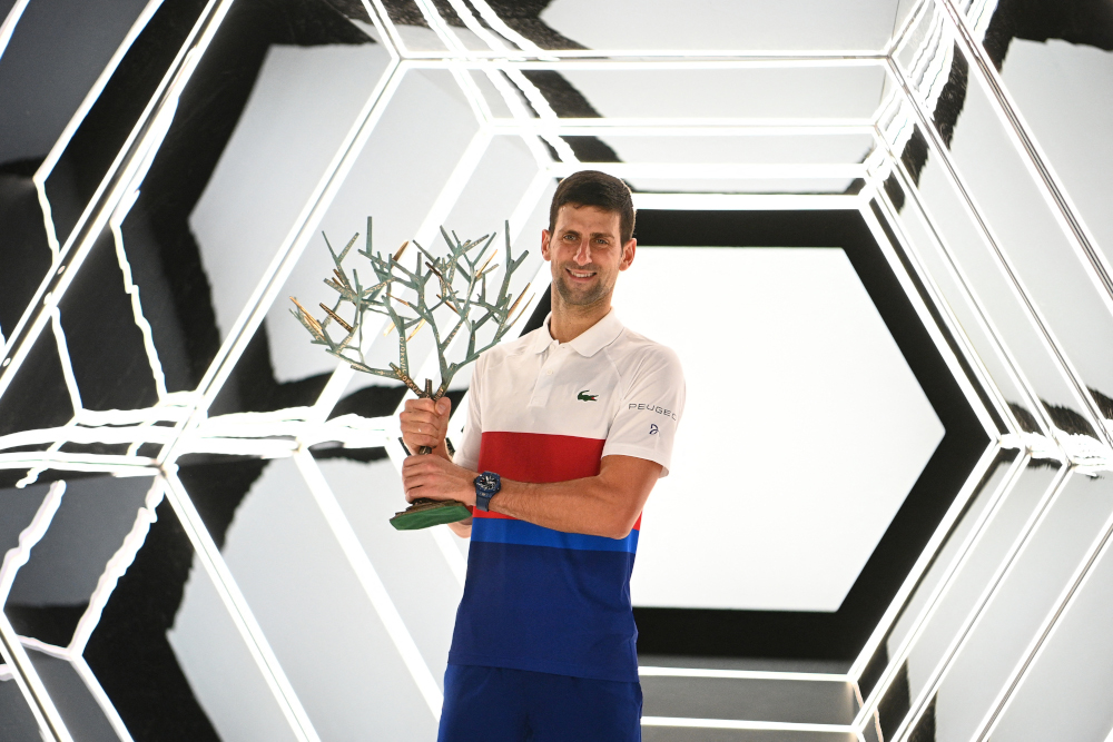 Serbiau00e2u20acu2122s Novak Djokovic poses with the trophy after winning against Russiau00e2u20acu2122s Daniil Medvedev at the end of their menu00e2u20acu2122s single final tennis match on the last day of the ATP Paris Masters at The AccorHotels Arena in Paris, November 7, 2021. u00e2u20acu201d AFP pi