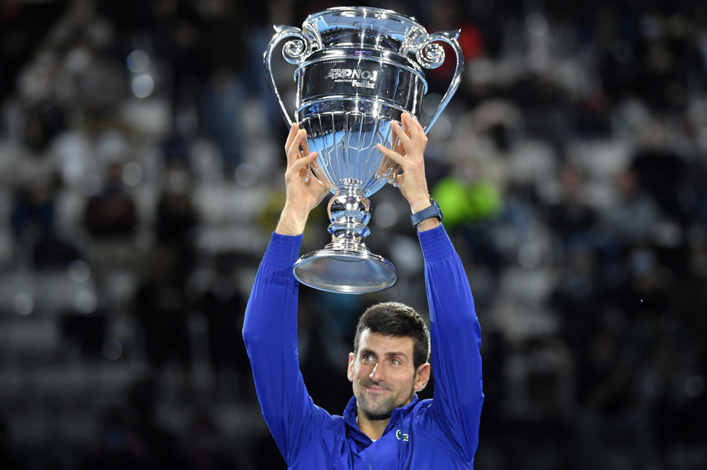 Serbiau00e2u20acu2122s Novak Djokovic celebrates with the ATP number 1 player trophy after winning to Norwayu00e2u20acu2122s Casper Ruud during their single match of ATP Finalsu00e2u20acu2122 first round at the Pala Alpitour venue in Turin, November 15, 2021. u00e2u20acu201d AFP pic