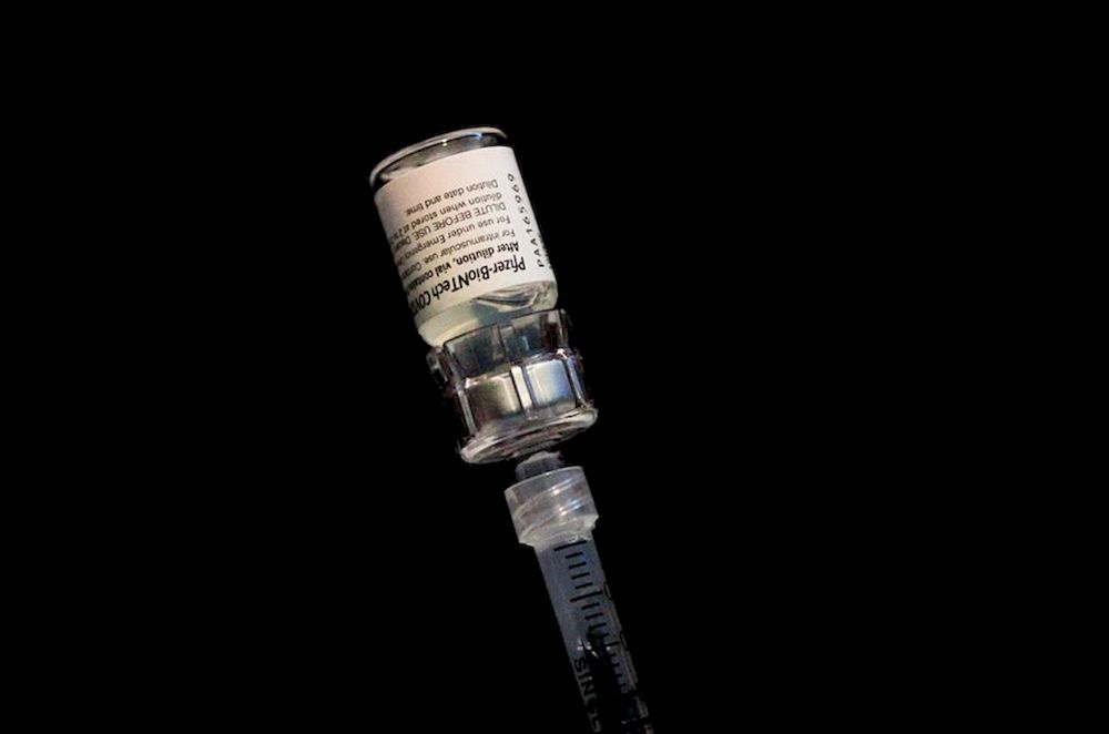 A health worker draws a dose of Pfizer-BioNTech coronavirus disease (Covid-19) vaccine from a vial during a vaccination event hosted by Miami u00e2u20acu201c Dade County and Miami Heat, at FTX Arena in Miami, Florida, US, August 5, 2021. u00e2u20acu201d Reuters pic
