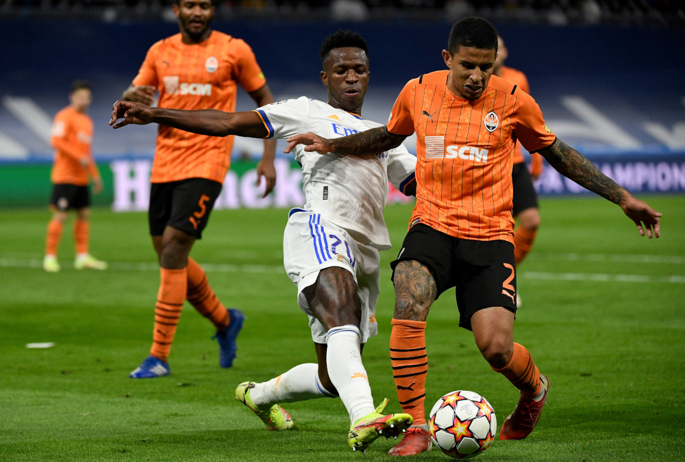 Real Madridu00e2u20acu2122s Vinicius Junior fights for the ball with Shakhtar Donetsku00e2u20acu2122s Dodo during the Uefa Champions League first round group D match at the Santiago Bernabeu stadium in Madrid, November 3, 2021. u00e2u20acu201d AFP pic 