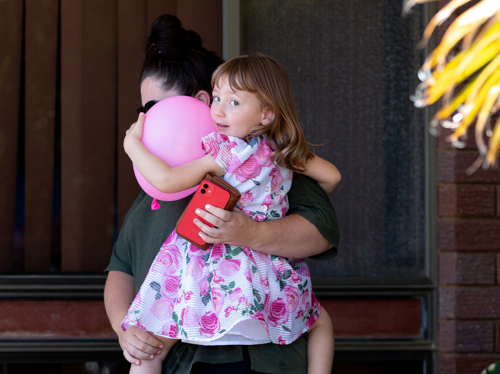 Cleo Smith and her mother Ellie Smith leave a house where the girl spent her first night after being rescued in Carnarvon, Australia, November 4, 2021. u00e2u20acu201d AAP/Richard Wainwright pic via Reuters