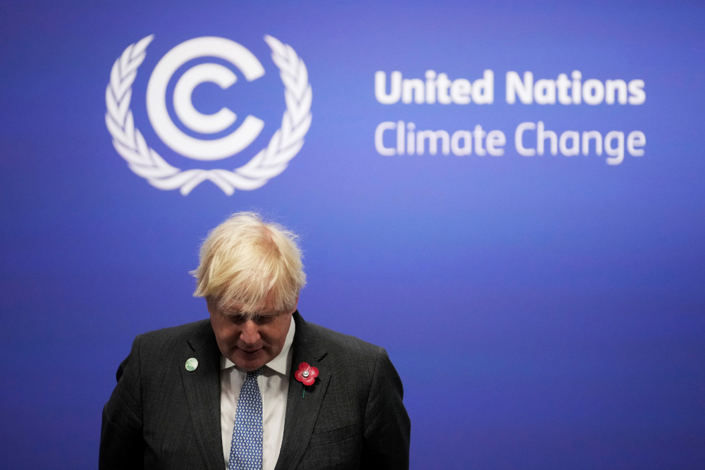 British Prime Minister Boris Johnson waits to receive attendees during the UN Climate Change Conference (COP26) in Glasgow, Scotland November 1, 2021. u00e2u20acu201d Christopher Furlong/Pool pic via Reuters