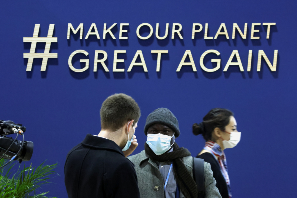 Delegates stand at a pavilion at the media centre during the UN Climate Change Conference (COP26), in Glasgow November 4, 2021. u00e2u20acu201d Reuters pic