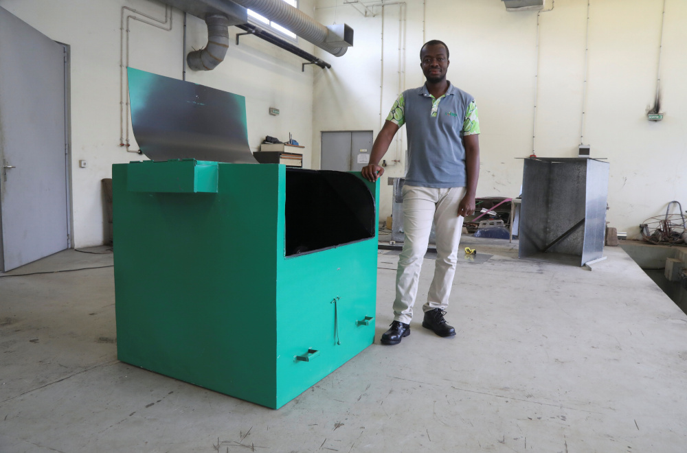Ivorian engineer and the inventor of an award-winning biowaste converter Kubeko, Noel Nu00e2u20acu2122Guessan, stands next to the machine, at a workshop in Yamoussoukro, Ivory Coast October 22, 2021. u00e2u20acu201d Reuters pic