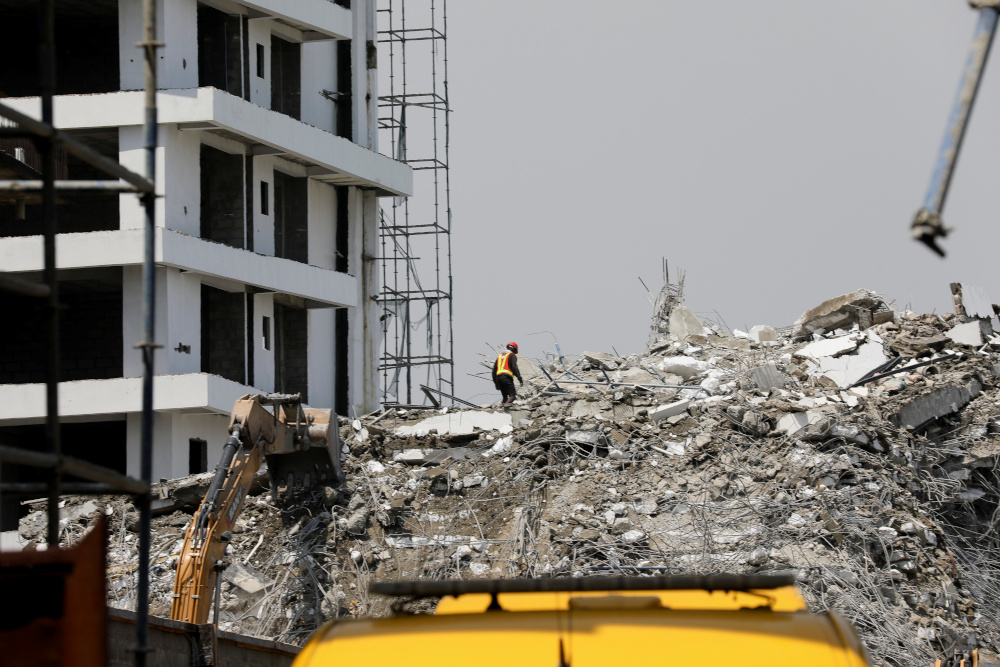 A rescue member works on the debris as search and rescue efforts continue at the site of a collapsed building in Ikoyi, Lagos November 2, 2021. u00e2u20acu201d Reuters pic