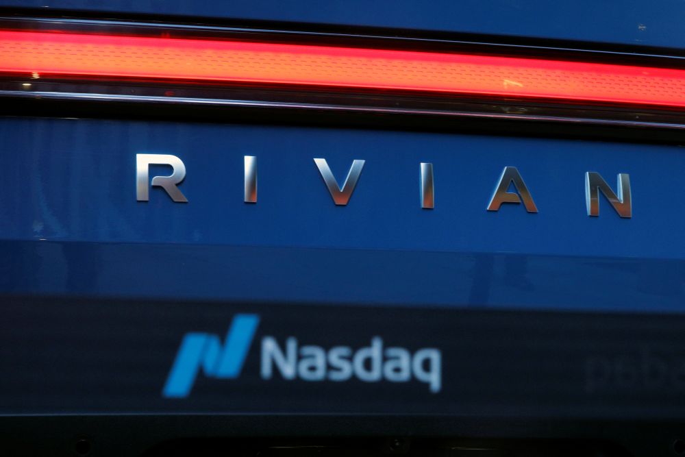 The company logo is seen on a Rivian R1T pickup, the Amazon-backed electric vehicle maker, as it is parked outside the Nasdaq Market site during the companyu00e2u20acu2122s IPO in Times Square in New York City November 10, 2021. u00e2u20acu201d Reuters picnn