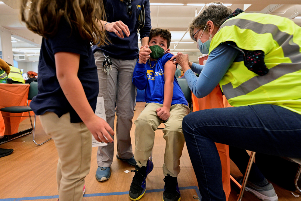 A child reacts while receiving a dose of the Pfizer-BioNTech coronavirus disease (Covid-19) vaccine at Smoketown Family Wellness Center in Louisville, Kentucky, US, November 8, 2021. u00e2u20acu201d Reuters picnn