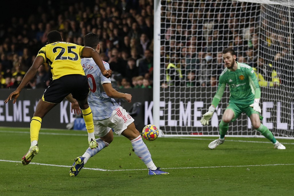 Watfordu00e2u20acu2122s Nigerian striker Emmanuel Dennis (left) scores his teamu00e2u20acu2122s fourth goal during the English Premier League match between Watford and Manchester United at Vicarage Road Stadium in Watford, England, November 20, 2021. u00e2u20acu201d AFP pic