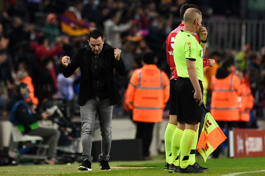 Barcelonau00e2u20acu2122s Spanish coach Xavi (left) reacts after Barcelonau00e2u20acu2122s forward Memphis Depay scored a goal during the Spanish league football match between FC Barcelona and RCD Espanyol, at the Camp Nou stadium in Barcelona, November 20, 2021. u00e2u20acu201d AFP pic