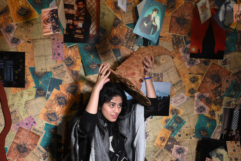 This picture taken on November 30, 2021 shows a visitor posing for pictures during a Harry Potter festival at the Government College University (GCU) campus in Lahore. u00e2u20acu201d AFP pic
