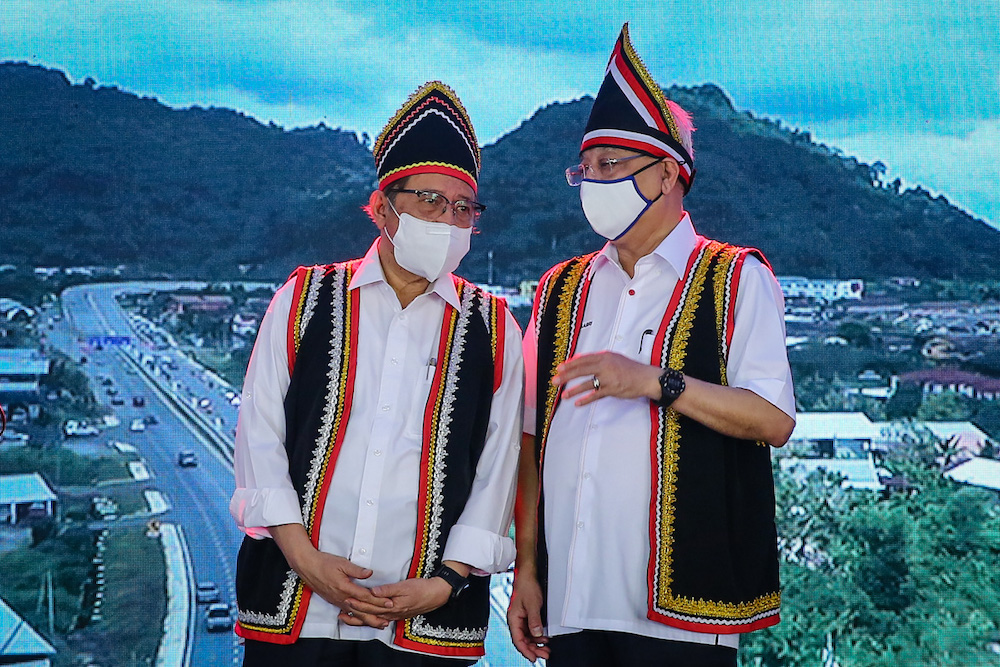 Sarawak Chief Minister Tan Sri Abang Johari Openg and Prime Minister Datuk Seri Ismail Sabri Yaakob at the launch of the Pan Borneo Sarawak Highway Serian Interchange section in Serian December 5, 2021. — Picture by Yusof Mat Isa