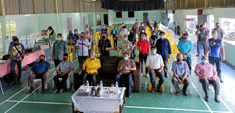 Ting (seated third left) and others at the programme in Kampung Luak. u00e2u20acu201d Borneo Post pic