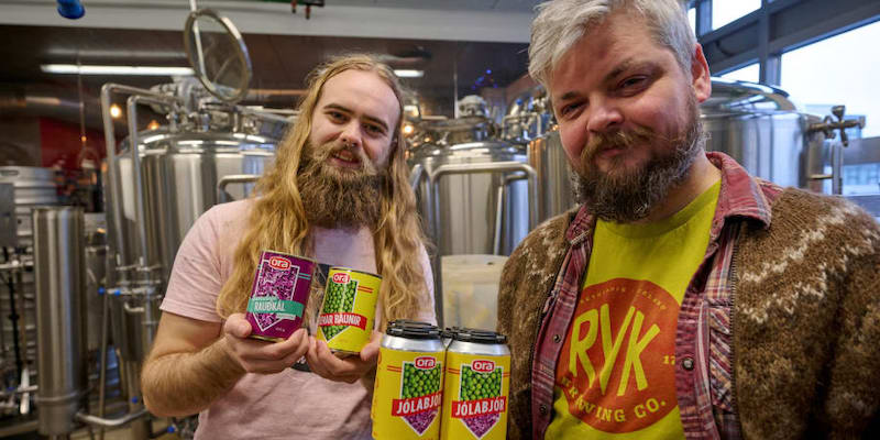 Brewmaster Valgeir Valgeirsson (right) and an employee pose with cans of u00e2u20acu02dcOra jolabjoru00e2u20acu2122, or Ora Christmas Beer. u00e2u20acu201d AFP pic