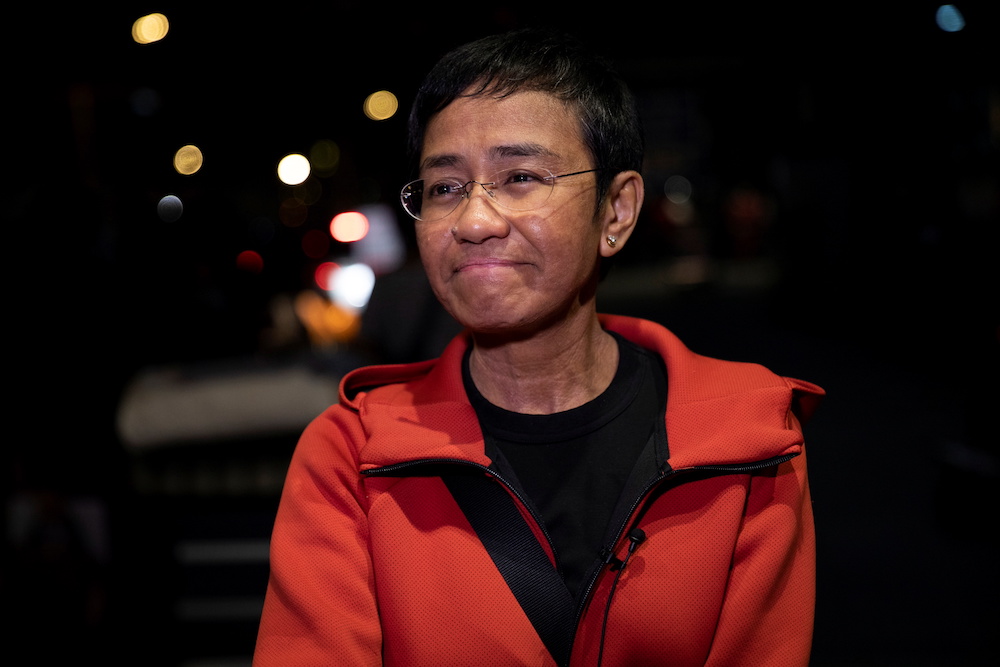 Philippine journalist Maria Ressa reacts while speaking to members of the media at Ninoy Aquino International Airport before leaving for her flight to Oslo in Pasay City, Metro Manila, Philippines December 7, 2021. u00e2u20acu201d Reuters pic