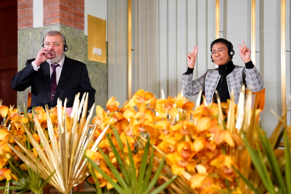 Nobel Peace Prize winners Dmitry Muratov and Maria Ressa attend the news conference with the Peace Prize winners, at the Nobel Institute in Oslo, Norway December 9, 2021. u00e2u20acu201d NTB/Torstein Boe via Reuters