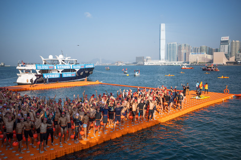 Swimmers pose for photos at the starting point during the annual harbour swimming race in Hong Kong December 12, 2021. u00e2u20acu201d AFP pic