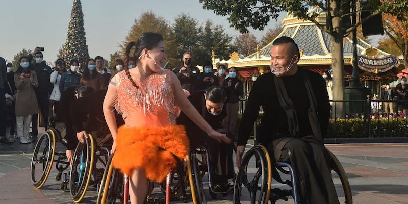 Wheelchair dancers from the Shanghai Oriental Pearl TV Tower Handicapped Art Troupe perform at Shanghai Disneyland, December 3, 2021. u00e2u20acu201d AFP pic