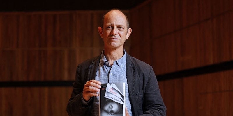 South African author Damon Galgut poses with his book 'The Promise' during the photo call for authors shortlisted for the 2021 Booker Prize. u00e2u20acu201d AFP pic